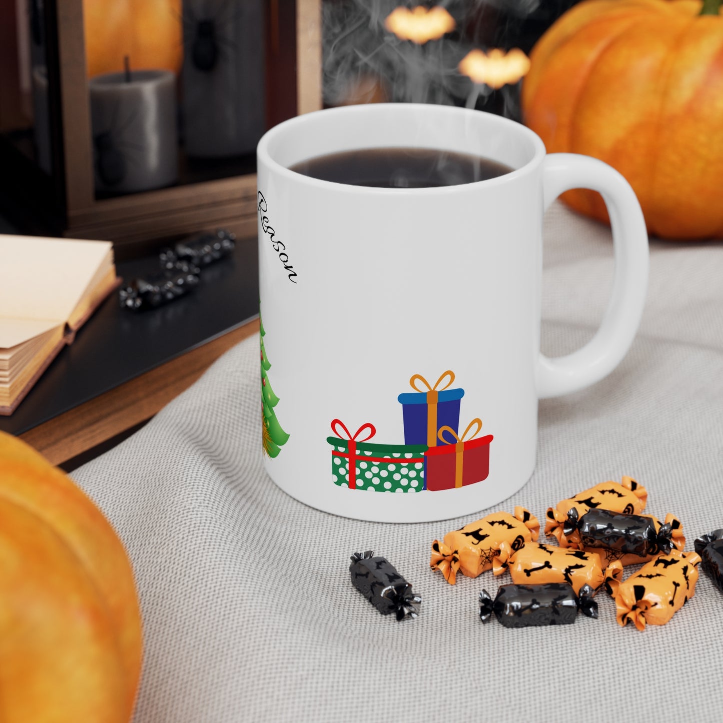 Christmas mug with baby Jesus, decorated tree, gifts, and “Jesus is the Reason” text