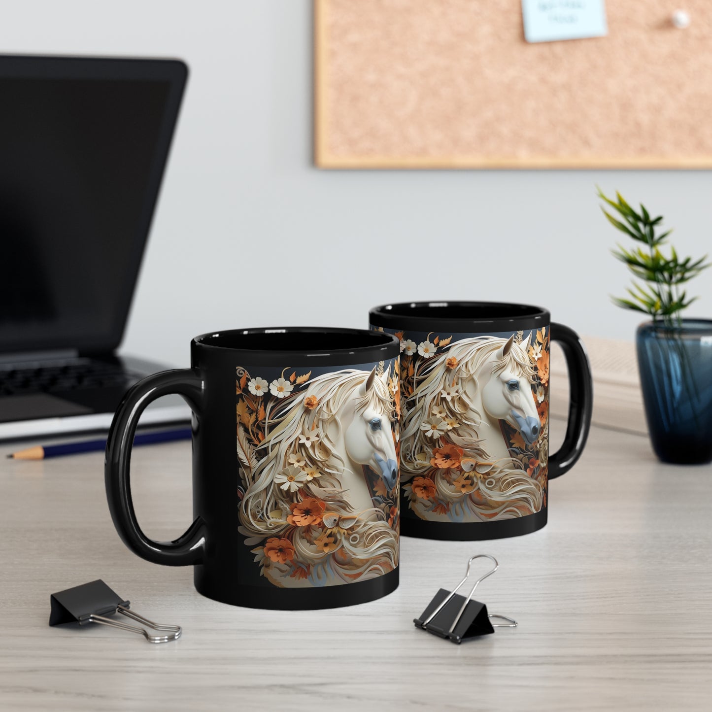 Glossy black ceramic mug featuring a white horse with a flowing floral mane surrounded by orange and cream flowers. 11oz, microwave and dishwasher safe.