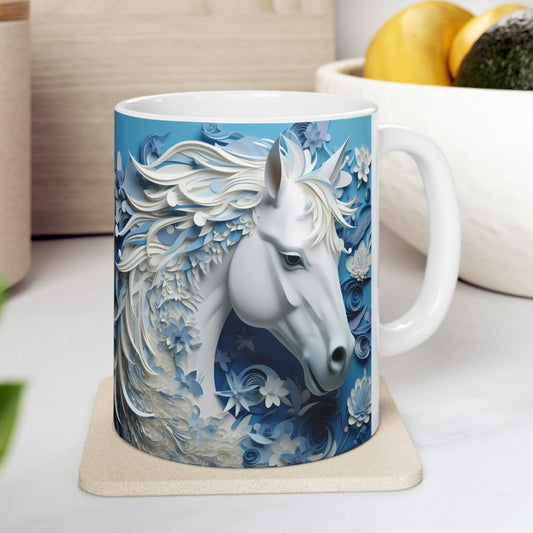 White ceramic mug featuring a sculpted-style white horse with flowing blue and white floral mane on a cool blue background. 11oz, microwave and dishwasher safe.