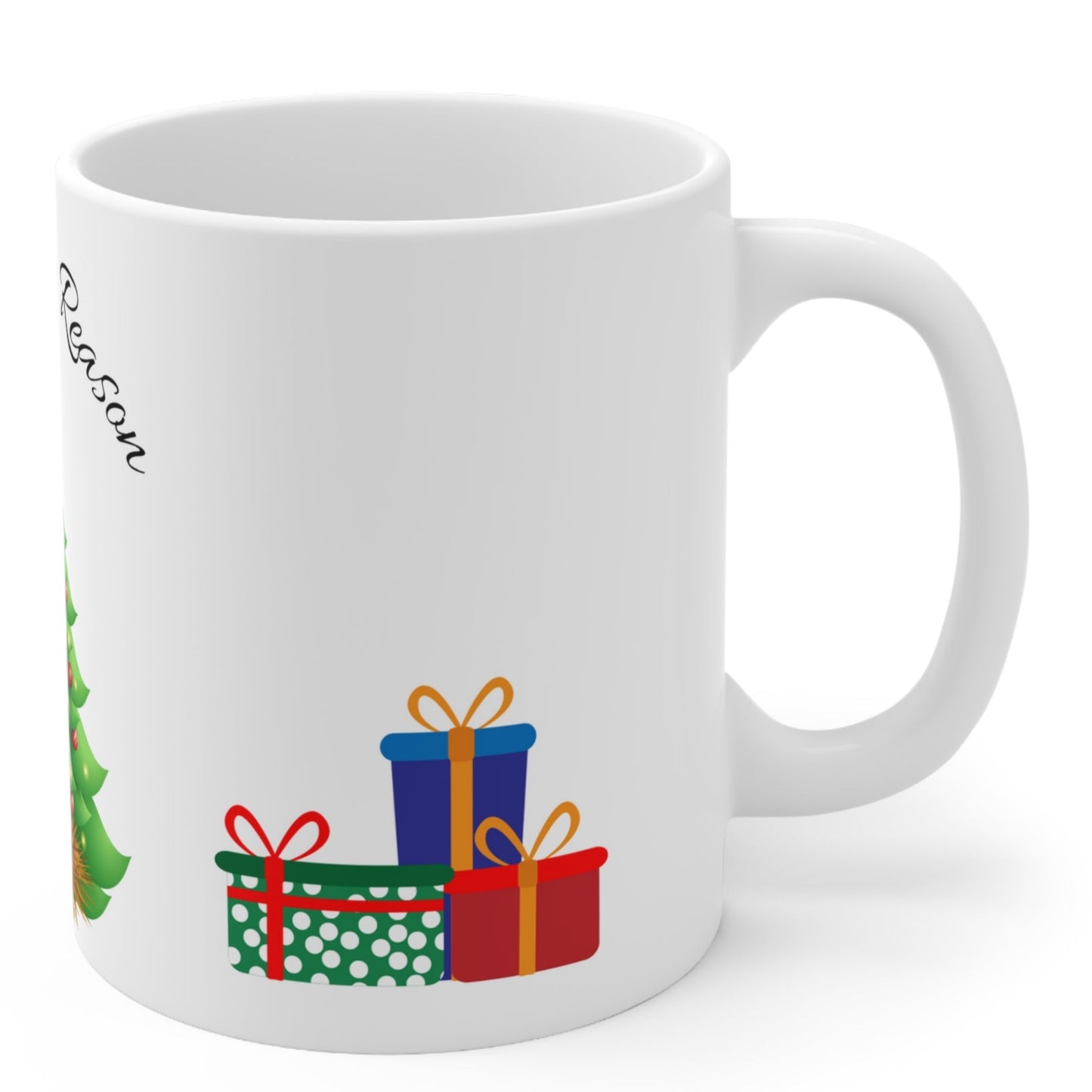 Christmas mug with baby Jesus, decorated tree, gifts, and “Jesus is the Reason” text