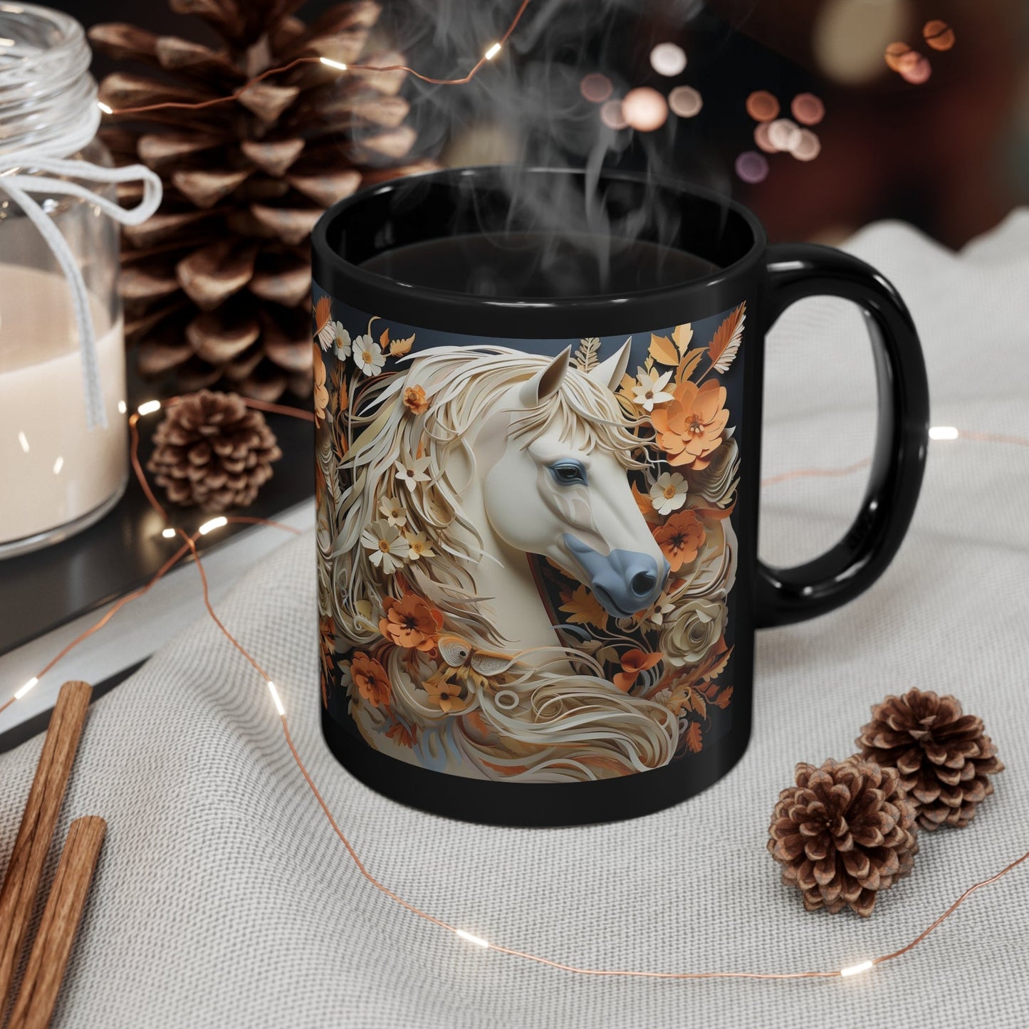 Glossy black ceramic mug featuring a white horse with a flowing floral mane surrounded by orange and cream flowers. 11oz, microwave and dishwasher safe.