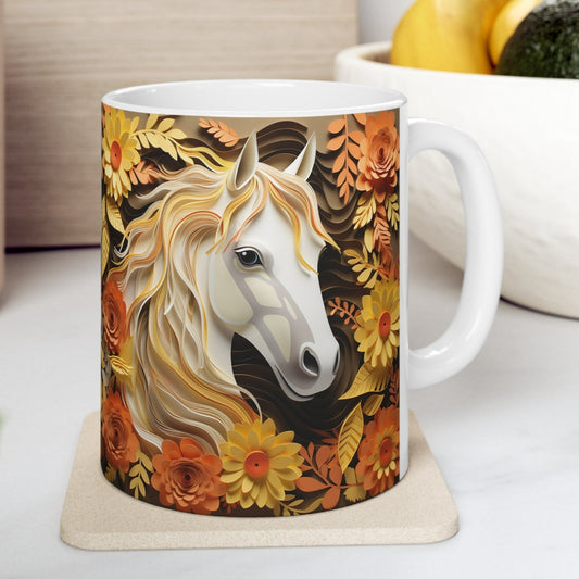 White ceramic mug featuring a sculpted-style white horse with golden mane surrounded by orange, yellow, and brown fall flowers and leaves. 11oz, microwave and dishwasher safe.