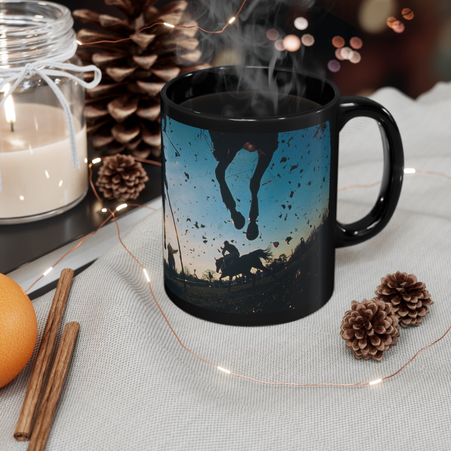 Dramatic black ceramic mug featuring a low-angle ground view of racing horses kicking up dirt at sunrise. 11oz, microwave and dishwasher safe.