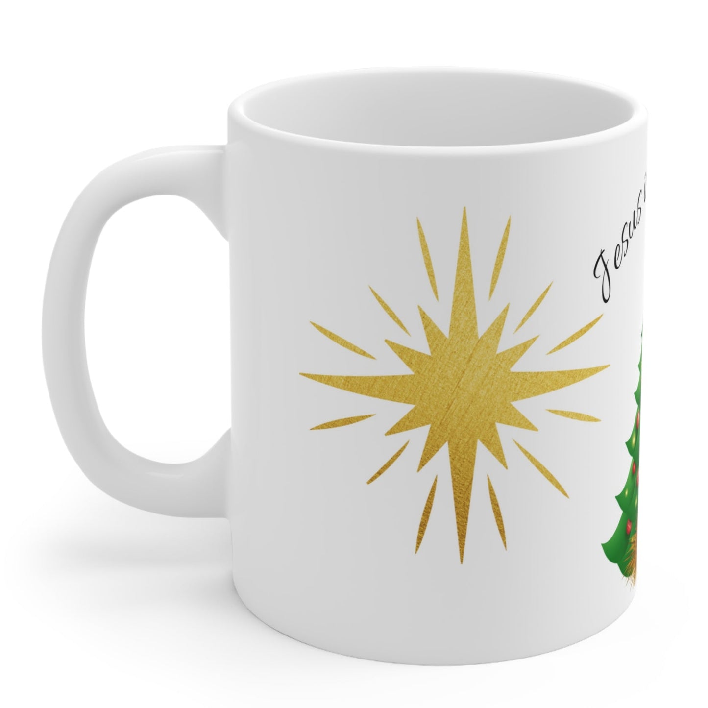 Christmas mug with baby Jesus, decorated tree, gifts, and “Jesus is the Reason” text