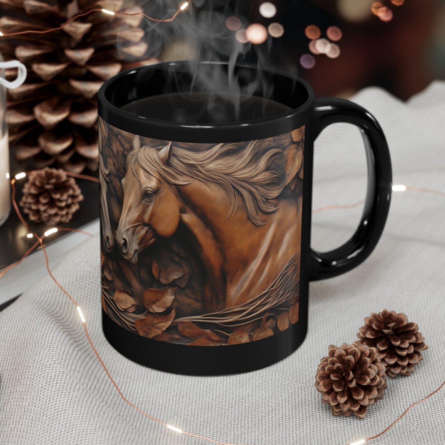 Glossy black ceramic mug with three sculpted-style horses in warm brown tones surrounded by swirling autumn leaves. 11oz, microwave and dishwasher safe.