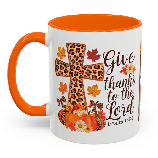 Christian fall mug with leopard cross, pumpkins, sunflowers, and Psalm 136:1 – Give thanks to the Lord – perfect Thanksgiving faith gift