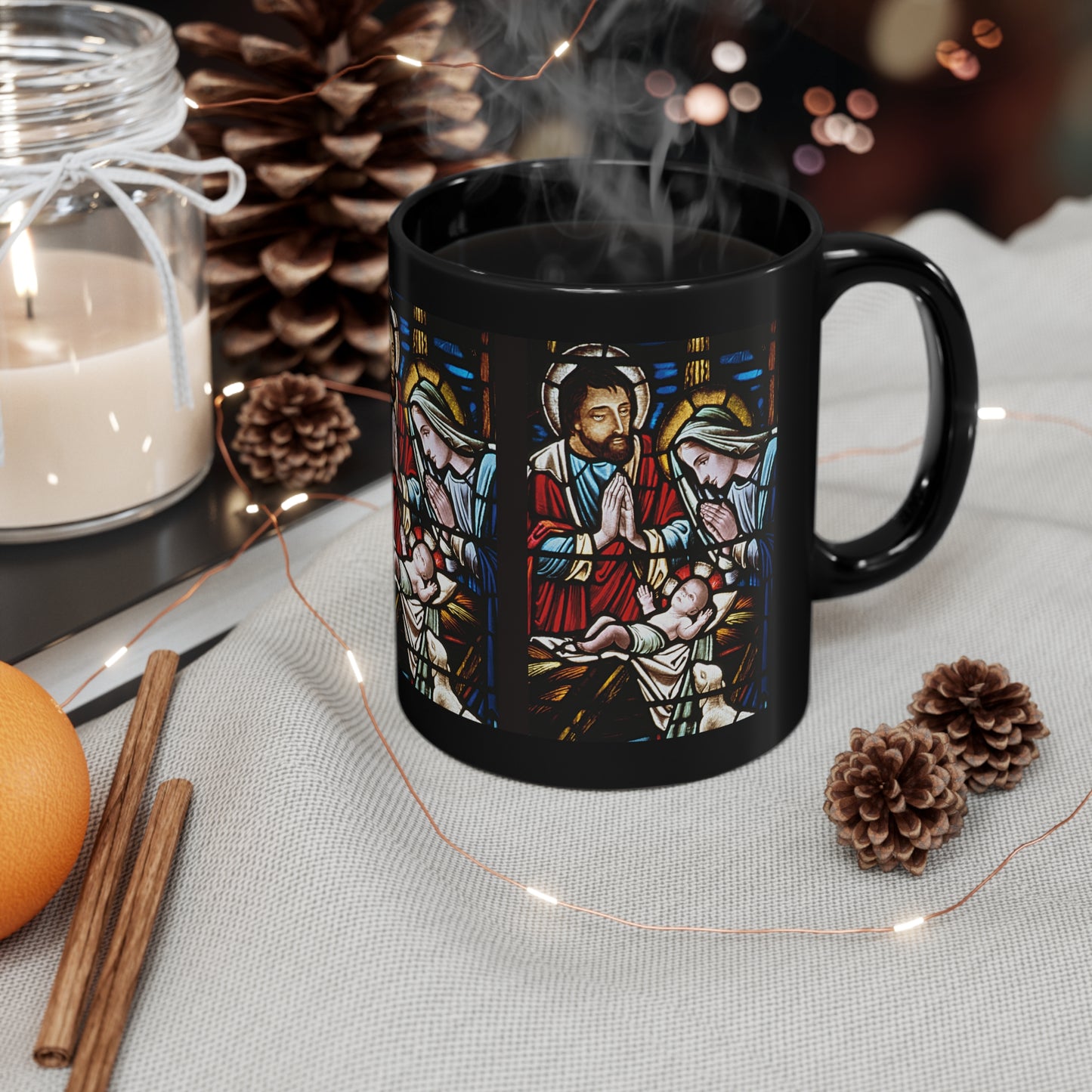 Glossy black Christmas mug with stained glass nativity scene of baby Jesus, Mary, and Joseph