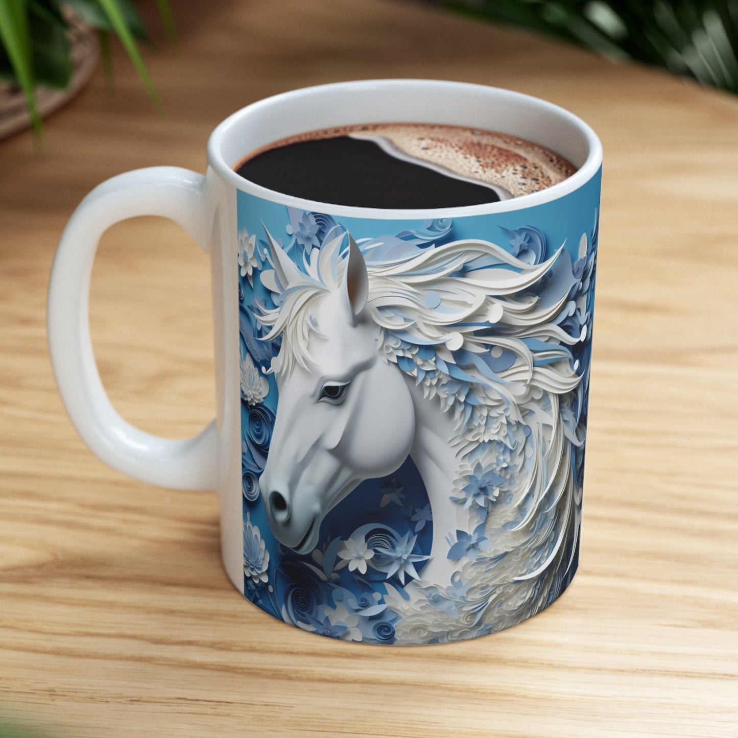 White ceramic mug featuring a sculpted-style white horse with flowing blue and white floral mane on a cool blue background. 11oz, microwave and dishwasher safe.